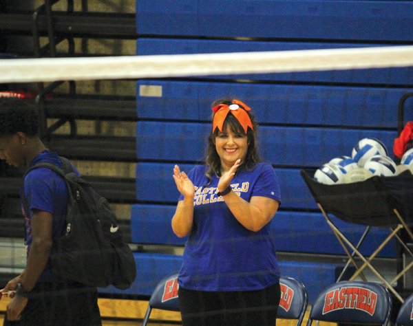 BRIANNA HARMON/THE ET CETERA History professor Kat Reguero cheers on the volleyball team while serving as guest coach in the conference opener against Brookhaven on Sept. 22.