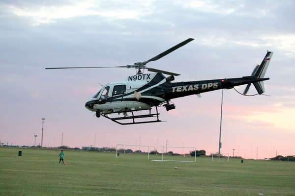 A Department of Public Safety helicopter takes off from the Eastfield soccer fields after visiting campus for National Night Out. Photo by Ahmad Ashor/The Et Cetera