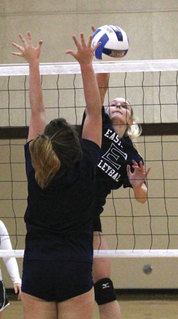 Megan Murphy rises for a kill at a recent practice. Photo by James Hartley