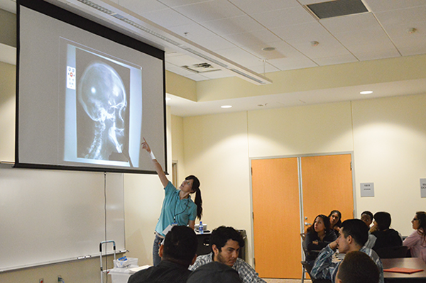 Jessie Crowley of the Perot Museum speaks to students at the Pleasant Grove campus.