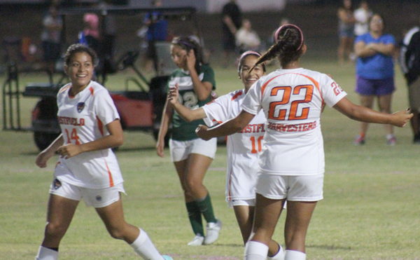 Karla Gutierrez, Elizabeth Cobar and Miriam Mendoza celebrate after one of Eastfield’s four goals against Richland on Oct. 13.  PHOTO BY DAVID SANCHEZ/THE ET CETERA