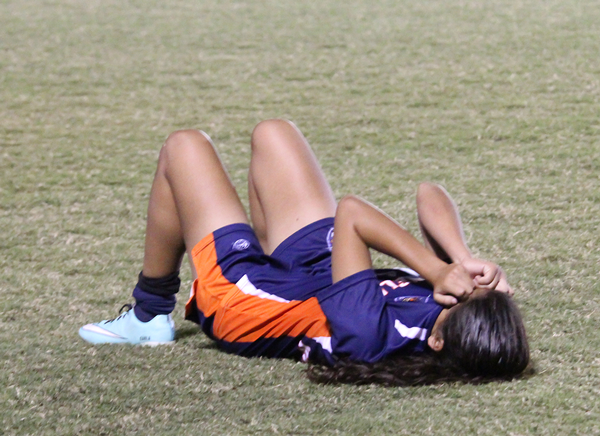 Karla Gutierrez lays on the ground after a season-ending loss to Richland in the Metro Athletic Conference Tournament championship on Oct. 29. PHOTO BY DAVID SANCHEZ/THE ET CETERA