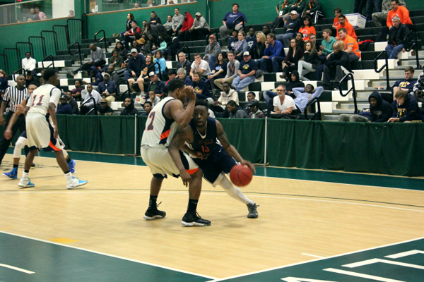 Eastfield’s Ed Williams drives around a Nassau defender on his way to the basket. PHOTO BY BRIANNA HARMON/THE ET CETERA