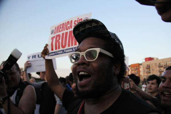 James Hartley/The Et Cetera LGBT anti-Trump protestor Chaaz Quigley debates with a Trump supporter who Quigley says is not welcome in the protestors camp.