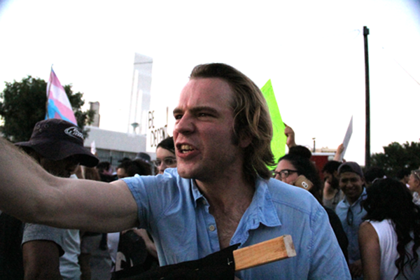 James Hartley/ The Et Cetera A protestor shouts, "You're nothing but hateful bigots," at Trump supporters after the rally while holding a banner that reads, "Make Texas Mexico again."