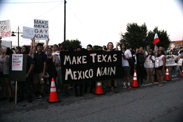 James Hartley/The Et Cetera As the rally ends and protestors and Trump supporters met in the streets, Dallas Police separate the two groups to avoid violence.