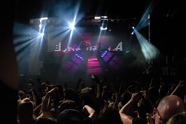 Ravers dance as lights flash in sync with the music. Photo David Sanchez/The Et Cetera