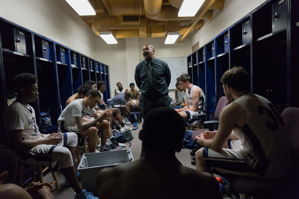 Coach Fletcher, center, gives his post-game delivery in the locker room following the Harvesters loss to Brookhaven. Photo by Andrew Gonzlaes/The Et Cetera.