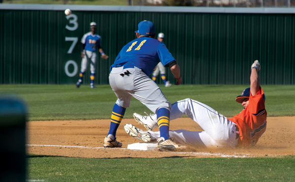 Gabe Guzman slides to the safety of third base as the Harvesters shut out the Mountain View Lions 11-0 on Feb. 24. Photo by Andrew Gonzales/The Et Cetera.