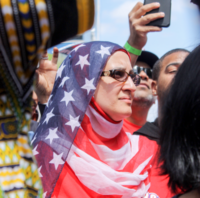 A protester dons an American flag hijab during the April 9 march. The event was a demonstration against President Donald Trumps recent immigration policy, which has conflicted with the views of advocates for undocumented immigrants and middle eastern refugees. Photo by Heidi McCaslin 