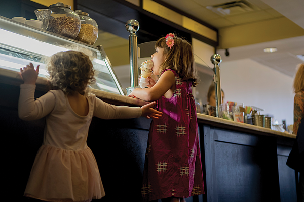 Children enjoy ice cream in the Hypnotic Emporium, owned by the founders of Hypnotic Donuts. Photo by Jesus Ayala/ The Et Cetera