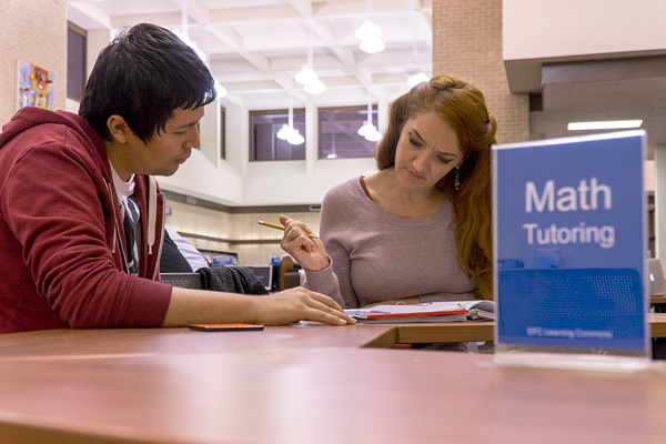 Melodie Stairs, Management major gets math tutoring help form computer science major, Luis Pulido, at the tutoring center in the library on Nov. 21, 2017. Photo by Yesenia Alvarado/The Et Cetera