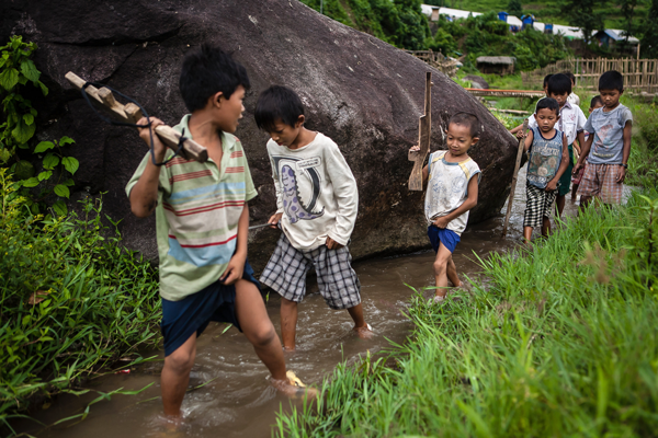 Young boys in Kachin state play war games while Morty Ortega covers the Kachin refugees’ displacement. Courtesy of Morty Ortega