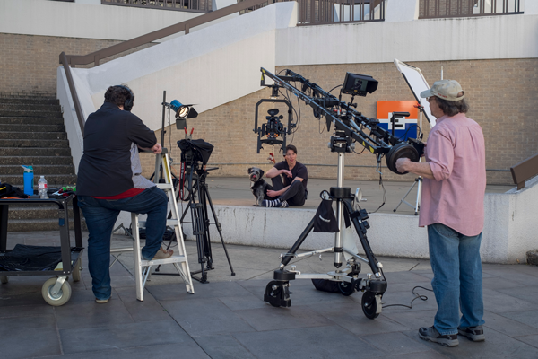 Nick Vera films a video on pet adoption with his dog, Stuff, in the designated free speech area in the lower courtyard. Photo by Jesus Ayala/The Et Cetera