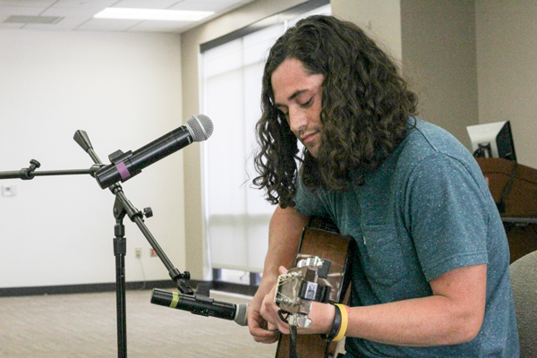 Michael Posival, a member of Foundation 45 preformed eight
original songs during the “Unplugged: Breaking Stigma Through Music” event on March 29. Photo by Anthony Lazon/The Et Cetera