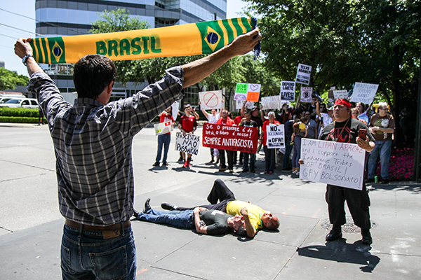 Leroy Pena of the Red Handed Warrior Society and former Eastfield College graduate confronts counter-protesters outside the Old Parkland building in Dallas on May 16. Protesters were vocal about President Bolsonaros stance on issues such as education, LGBTQ rights and environmental welfare. Photo by Anthony Lazon/The Et Cetera