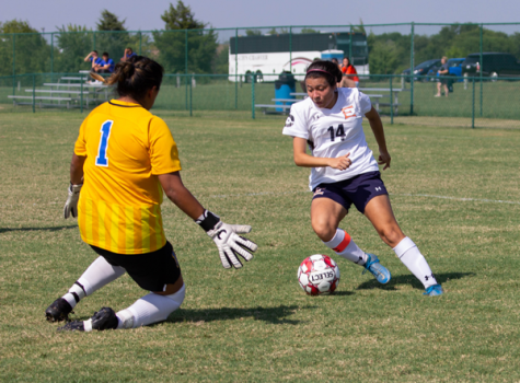 Laisha Garcia dribbles the ball beside the goalie during a game against Jarvis Christian College on Aug. 26. Photo by Rory Moore/The Et Cetera