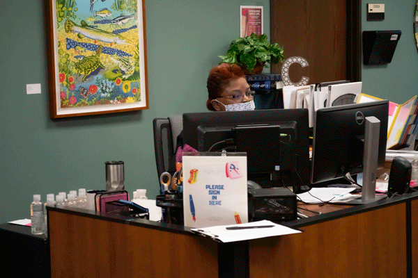 Corine Burnett helps students and employees who come into Information Central. Photo by Chantilette Franklin/The Et Cetera