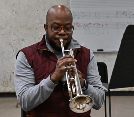 Music faculty Oscar Passley plays the trumpet during a Jan. 26 private lesson. Photo by Rory Moore/The Et Cetera 