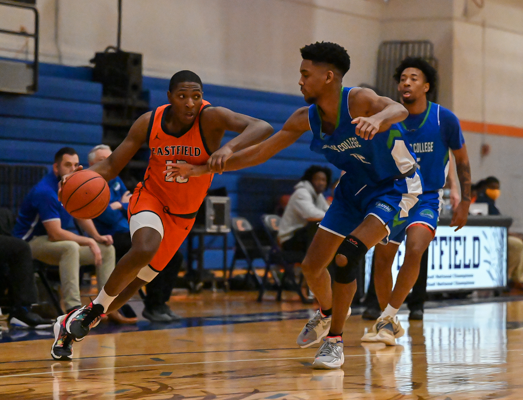 Spencer Simes dribbles the ball past two North Lake players on Jan. 22. Photo by Rory Moore/The Et Cetera