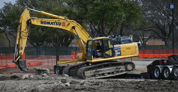 An excavator breaks up concrete in Parking Lot 2 on Feb. 21. Photo by Rory Moore/The Et Cetera 