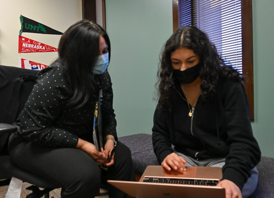 Christina Ybarra, left, works with Andrea Estrada on a project. Photo by Rory Moore/The Et Cetera