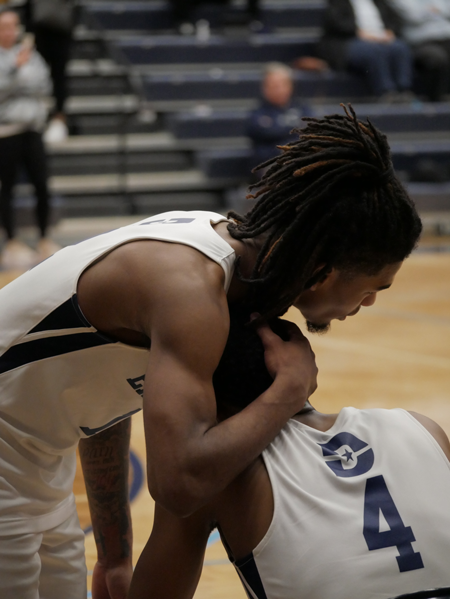 Geontay Davis and Jacore Williams react to the Harvesters 80-66 loss against Rock Valley Saturday afternoon. Photo by Manny Willis/The Et Cetera