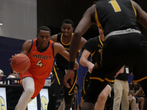 Jacore Williams drives past a defender in the Harvesters first game of the national tournament on March 9. The Harvesters scored an 82-67 win against the Community College of Philadelphia. Photo by Manny Willis/The Et Cetera
