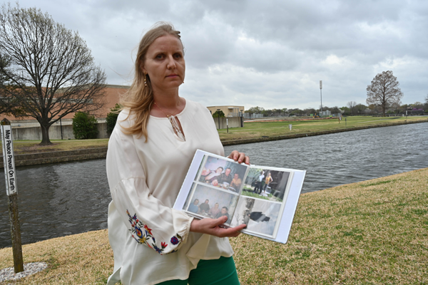 Richland student success coach Viktoriya Almazan holds pictures of family members who are still in Ukraine. Photo by Rory Moore/The Et Cetera