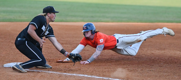 Jayden Morgan dives into third base. Photo by Rory Moore/The Et Cetera