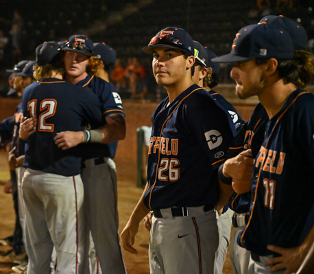 The Eastfield Harvesters baseball team watches the closing ceremonies of the World Series after losing to Herkimer finishing runner-up.