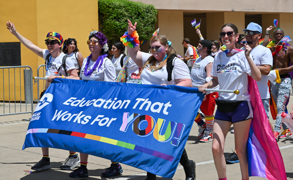 Students and faculty members of Dallas College march through Fair Park at the Pride Parade in Dallas, Texas on June 5.