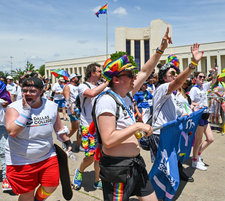 Representatives of Dallas College cheer with the crowd at the Pride Parade in Dallas, Texas on June 5.