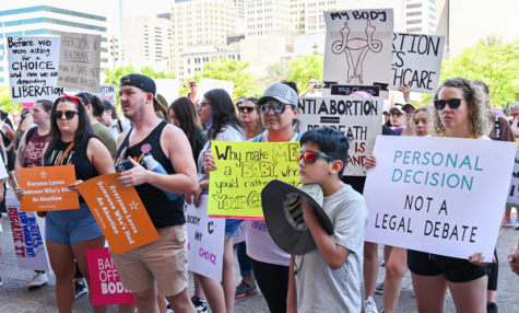 Abortion-rights protesters listen to various speakers at the Dallas Rally for Abortion Justice.