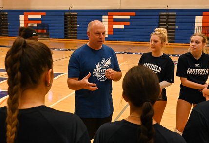 Eastfield volleyball coach Phil Nickel speaks with the team after practice in the gymnasium on September 6.