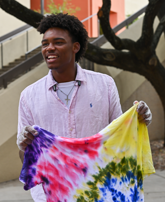 Lawson Collins (19, Social Work) holds a shirt he tie-dyed.