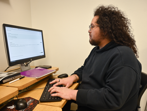 Alessandro Ramirez works on an assignment for English 1301 on a computer.