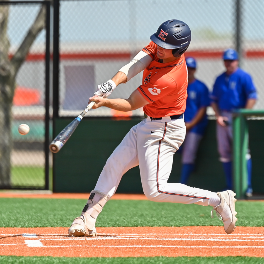 Cade Conway swings at a baseball