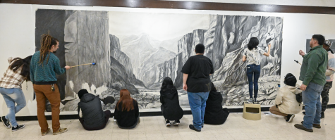 students work on a mural