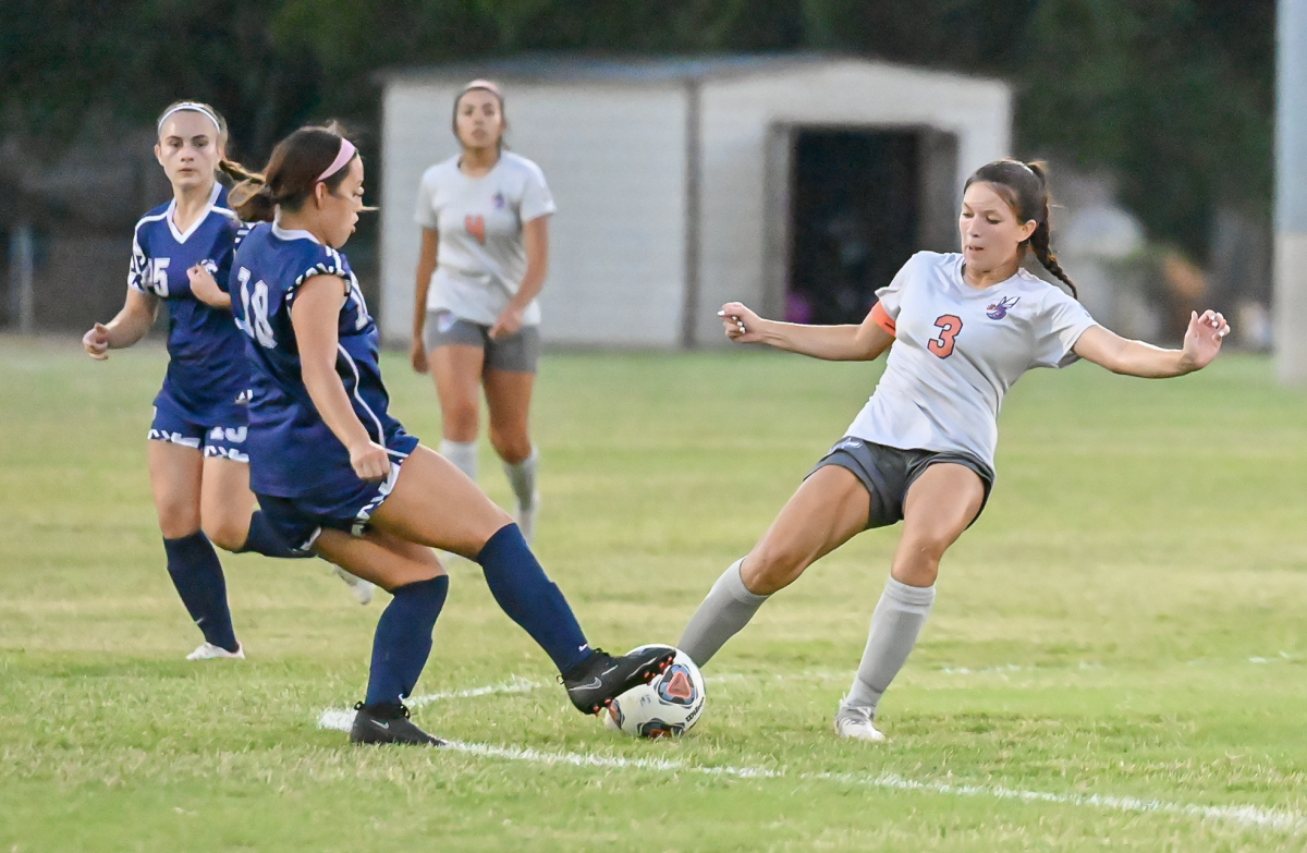 Forward Sophie Palomino clashes with NAU’s Tanya Rivera for possession.
