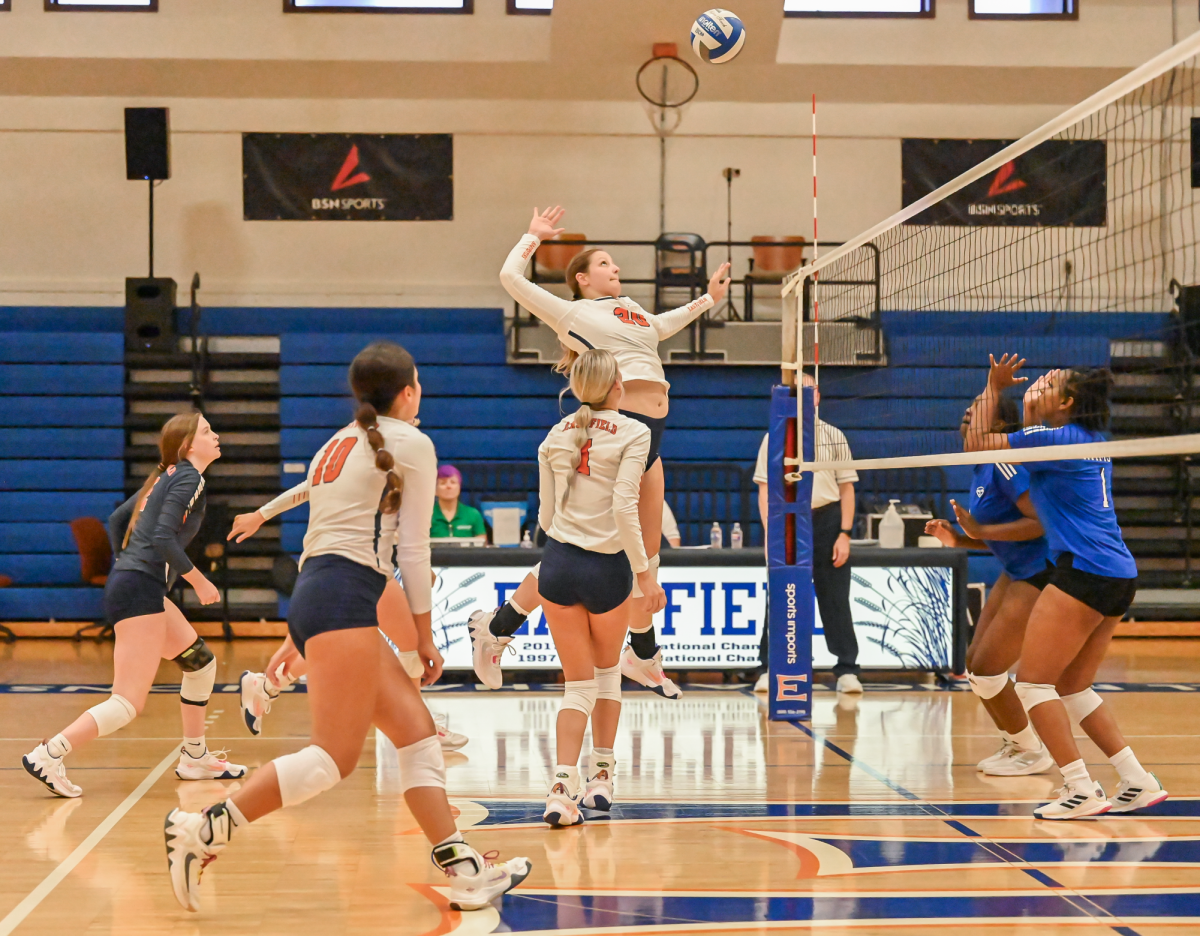 Middle blocker McKenzie Anderson makes an attack against Southwestern.