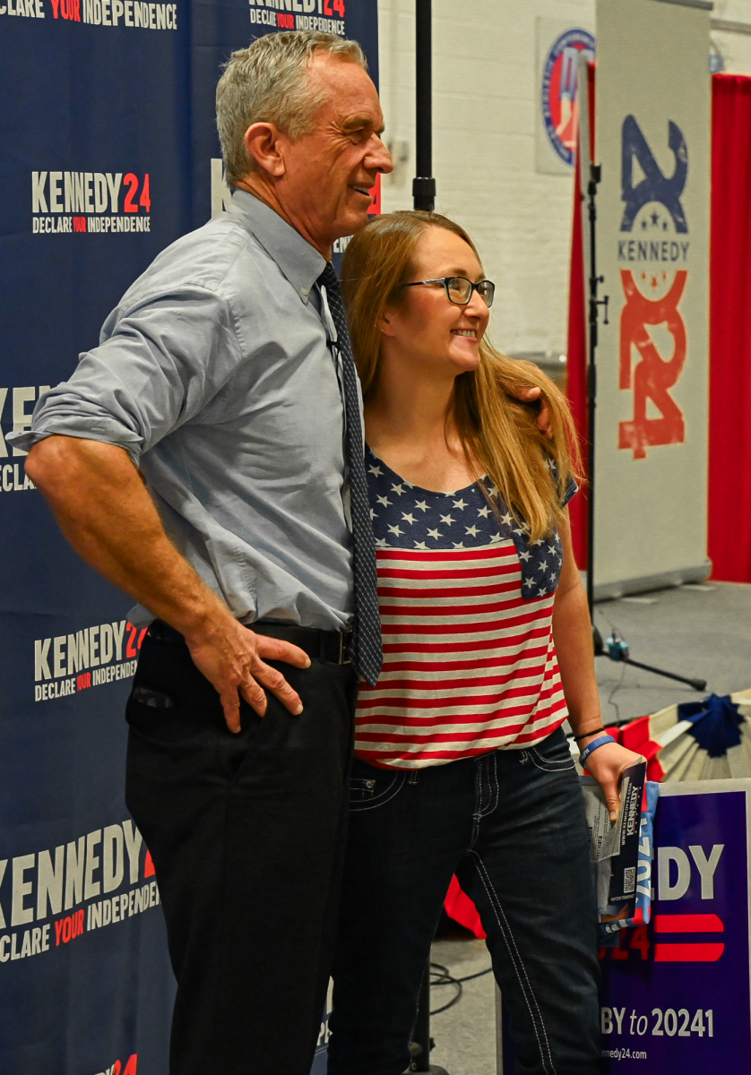 Kennedy poses with a supporter for a selfie after his rally.