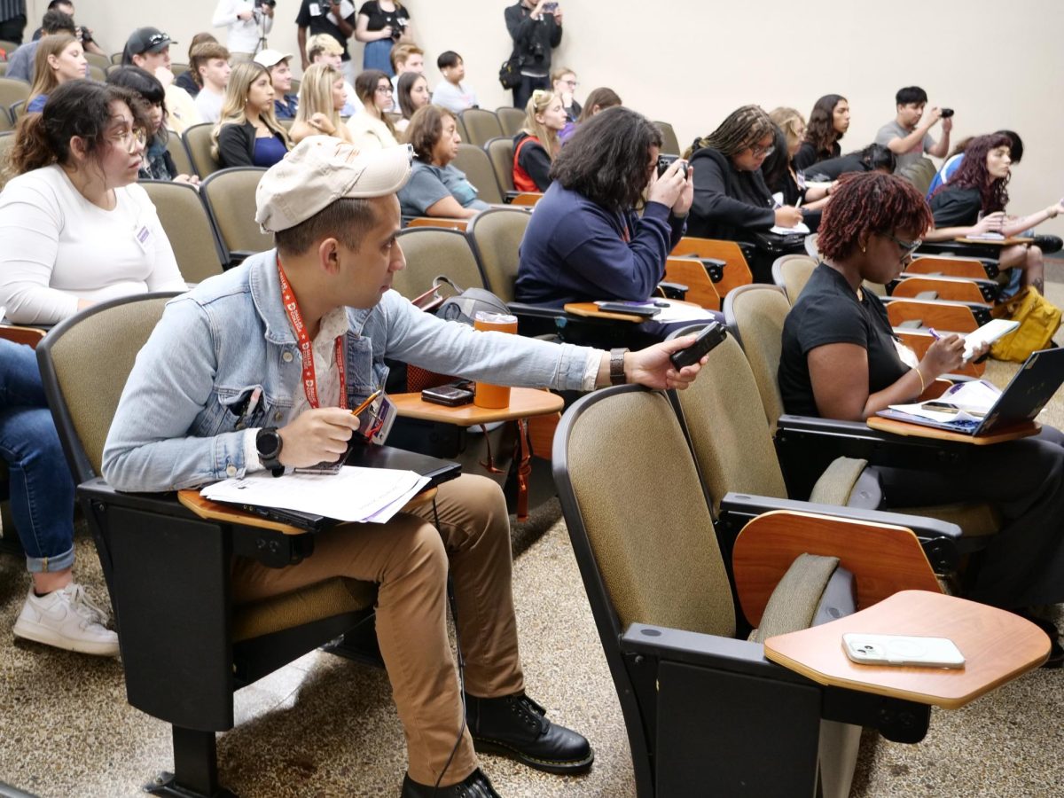 Eric Herrera (left), Braxton Piatt (with camera) and Fazy Campuzano (bottom right) compete in story reporting contest at the conference.