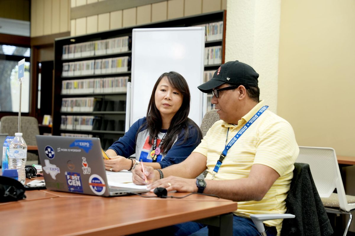 Student Carlos Alvaredo (pictured on the right) receiving tutoring from Djan Soeralaya in the  Learning Commons.