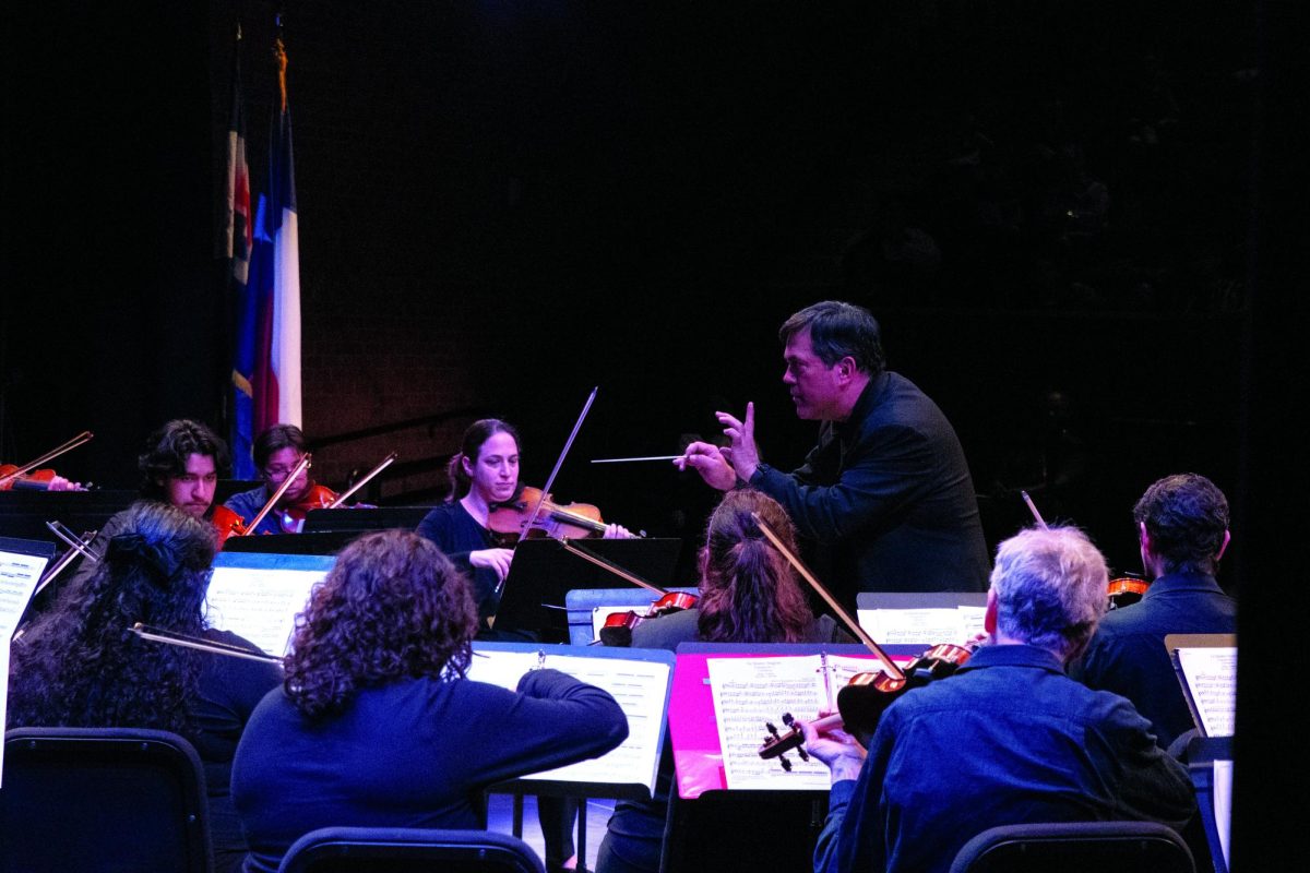 Conductor Abel Rodriguez watches students improve and develop. He strives to instill inspiration and motivation in his students.
