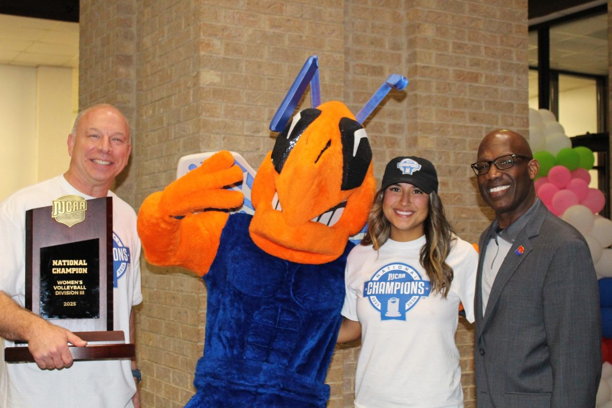 From left to right: Coach Phil Nickel, the Harvester Mascot, Assistant Coach Lexus Greschaw and Eastfield President Eddie Tealer provide guidance to the new players and mentor the younger players.